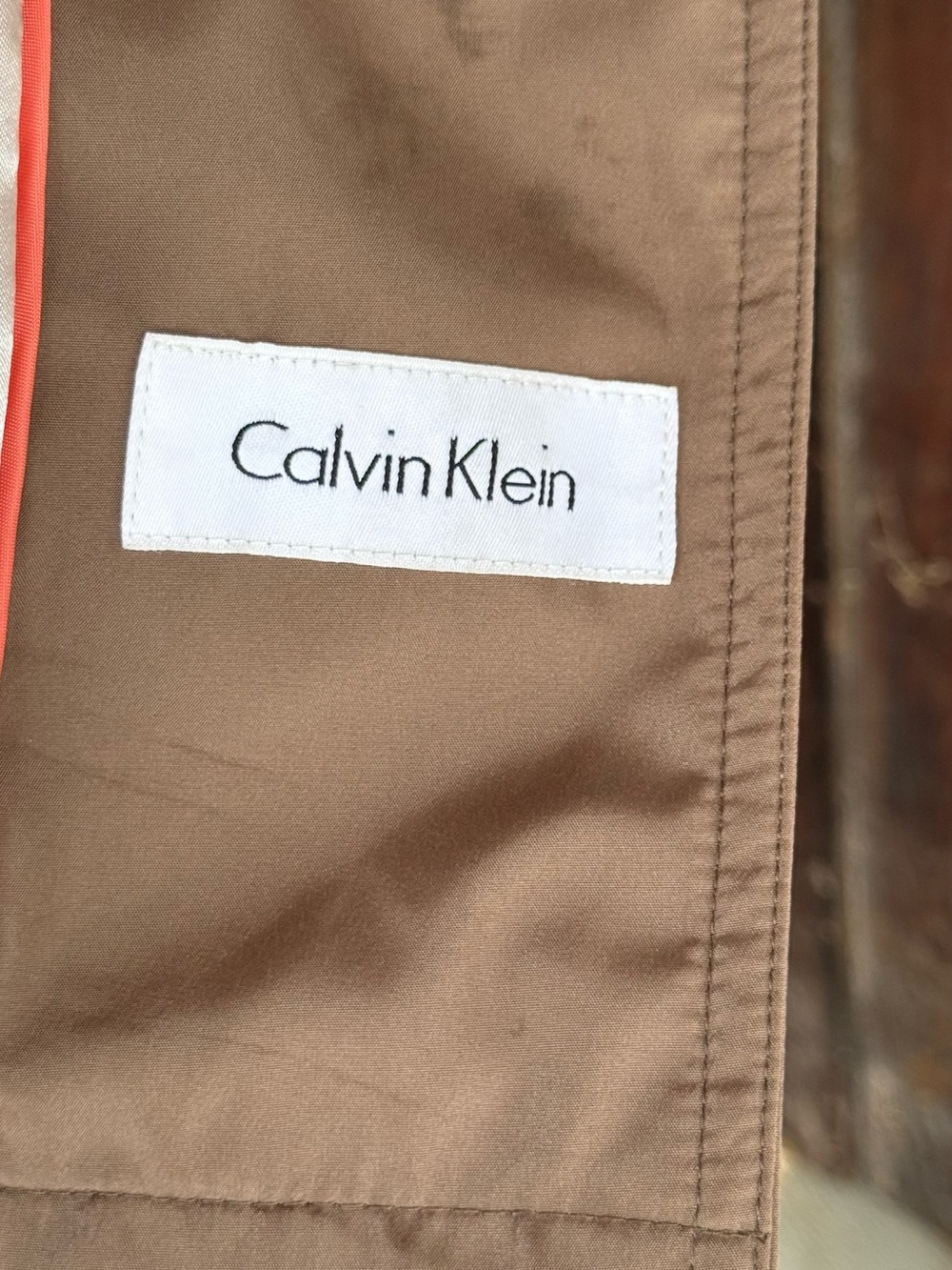 Calvin Klein woman’s trench coat.